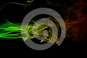 Abstract background smoke curves and wave reggae colors green, yellow, red colored in flag of reggae music