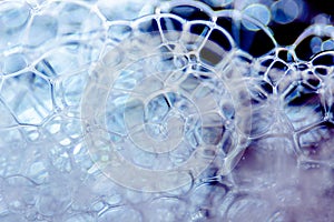 Abstract background of soap foam, suds, shower. Black background