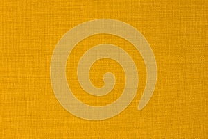 Background of soft yellow checkered textile material. Texture effect.t