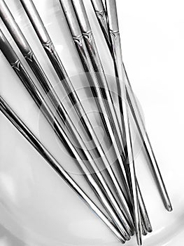 Abstract background, Stainless steel chopsticks isolated on white background