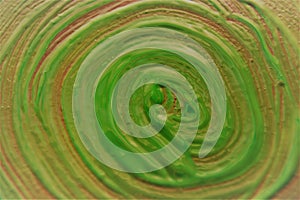 Abstract background. Swirl drawn with green acrylic paint