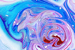 Abstract background swirls with dyes and glitter