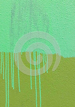 Abstract background with texture of paint drippings on green surface