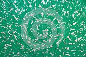 Abstract background. Texture of a painted green concrece wall with pilled paint on it. Wall with abstract pattern