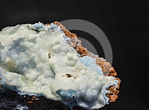 Abstract background or texture from a stone in a section with blue and white crystals. Natural and solid material. Minerals.