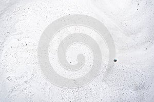 Abstract background texture of white soap foam. Chemical detergent backdrop.