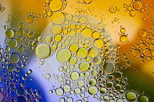 Abstract background with vibrant colours. Oil drops in water. Close colorful and artistic bubbles. Space pattern