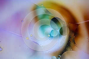 Abstract background with vibrant colours. Oil drops in water. Close colorful and artistic bubbles. Space pattern