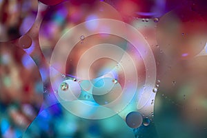 Abstract background with vibrant colours. Oil drops in water. Close colorful and artistic bubbles. Space pattern