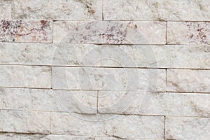 White stone wall in perspective with texture and bricks close up