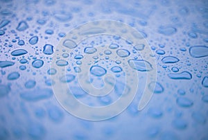 Abstract background - water drops on blue plastic