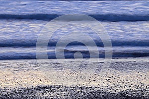 Abstract background of waves on beach in cool color scheme