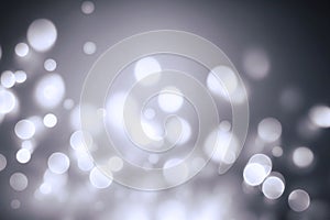 Abstract background with white colorful bokeh lights. De focused