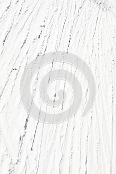 abstract background of white snow with traces of skiers