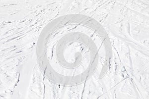 abstract background of white snow with traces of skiers