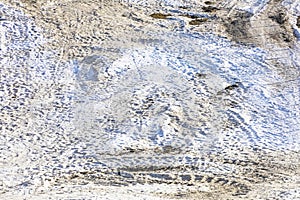 abstract background of white snow with traces of skiers