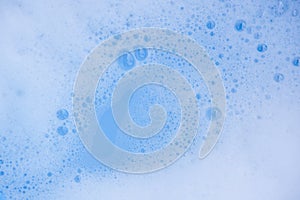 Abstract background white soapy foam texture. Shampoo foam with bubbles