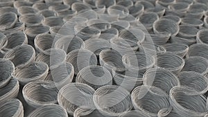 Abstract background from white spiraled coils