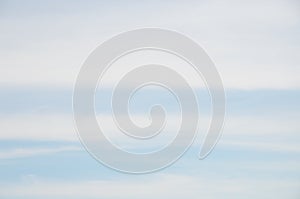 Abstract background of wide stripes white clouds on blue sky