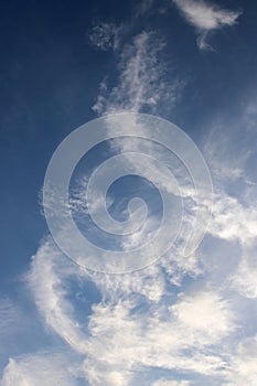 Abstract background, wispy white clouds, blue sky