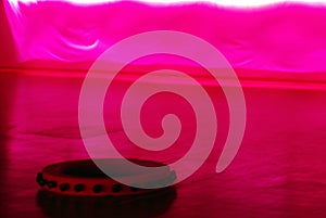 ABSTRACT BACKROUND- Blurred Studio Shot of Blowing Pink Silk and Tamborine