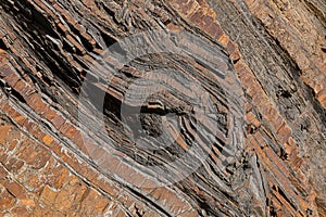 Abstract banded sedimentary sand and mud stone rocks photo