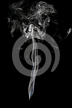 Abstract beautiful art. White smoke from the incense isolated on photo