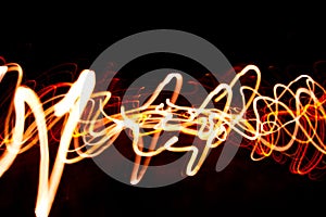 Abstract beautiful light painting photography, waves abstract light on black background