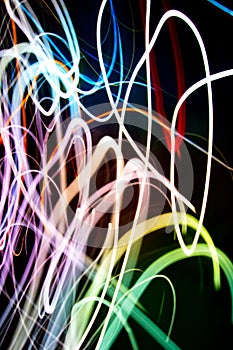 Abstract beautiful light painting photography, waves abstract light on black background