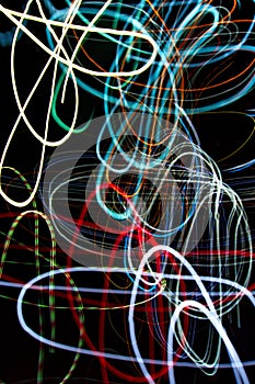 Abstract beautiful light painting photography, waves abstract light on black background