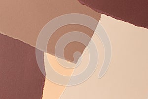 Abstract beige brown colors background. Grunge ripped torn paper pieces with ragged edges. Top view, copy space