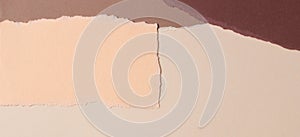 Abstract beige brown colors background. Grunge ripped torn paper pieces with ragged edges. Top view, copy space