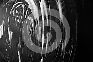 Abstract black background with white foam photo
