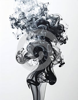Abstract Black Ink Cloud Dissolving In Clear Water With Wispy Tendrils Against White Background