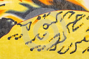 Abstract black orange drawing on a yellow background