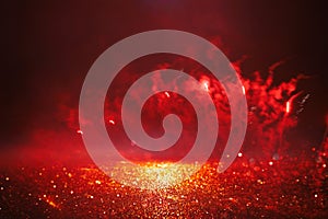 abstract black, red and gold glitter background with fireworks