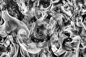 Abstract black smoke natural black smoke and white huge flame of strong fire. Dangerous firestorm abstract texture