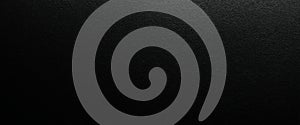 Abstract black texture background with subtle grainy surface finish