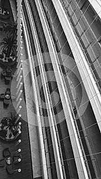 Abstract black and white image of long balconies and corridors a tmodern office building. Parallel lines