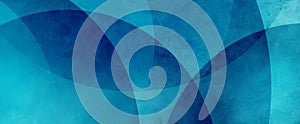 Abstract blue background design with texture, modern turquoise and dark blue rings and circles layered in art pattern photo