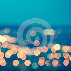abstract blue circular bokeh background, city lights with horizon, toned style, closeup