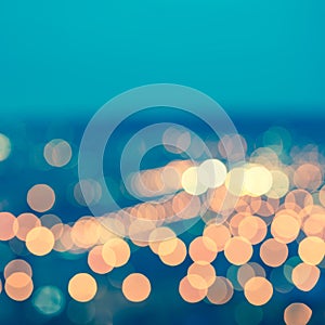 abstract blue circular bokeh background, city lights with horizon, toned style, closeup