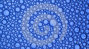 Abstract blue-graded water background and transparent soap bubble pattern
