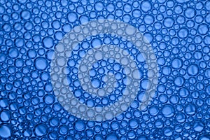 Abstract blue-graded water background and transparent soap bubble pattern