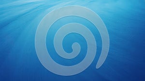 Abstract blue gradient background with light rays and soft texture patterns