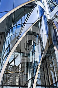 Abstract blue high rise commercial building skyscraper made of glass exterior. Modern skyscrapers in business district