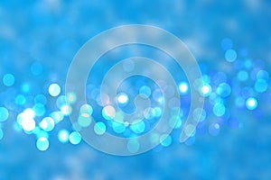 Abstract blue lightening bokeh circles from unterwater bubbles.