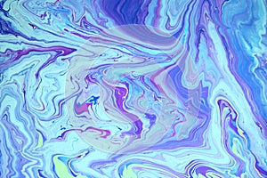 Abstract blue marble background. Acrylic paint flows freely and creates an interesting pattern.