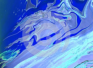 Abstract blue marble background. Acrylic paint flows freely and creates an interesting pattern.