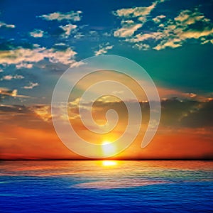 Abstract blue nature background with sea unset and clouds